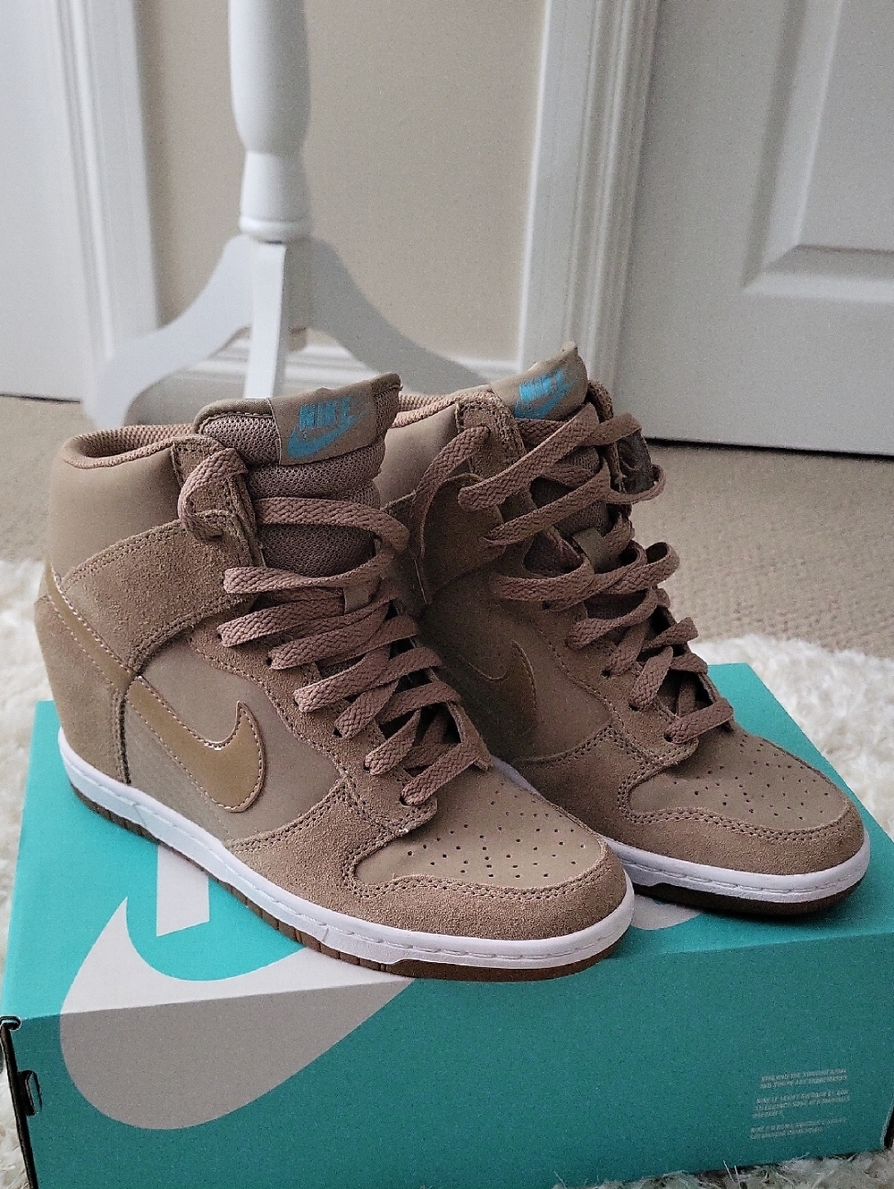 Nike Women’s High-Top Sneakers in Taupe with Blue Logo